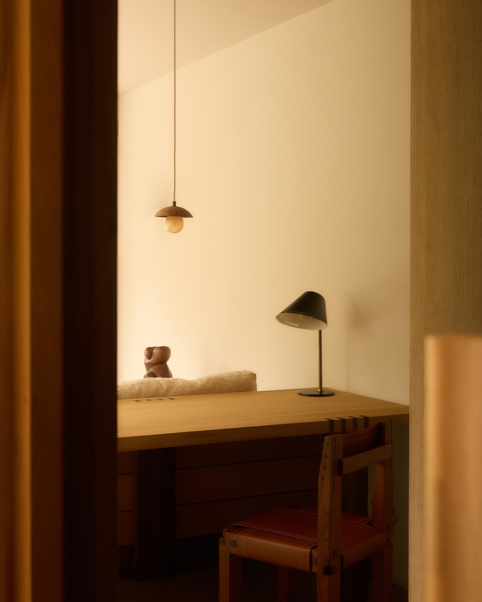 Quiet workspace framed by warm timber joinery